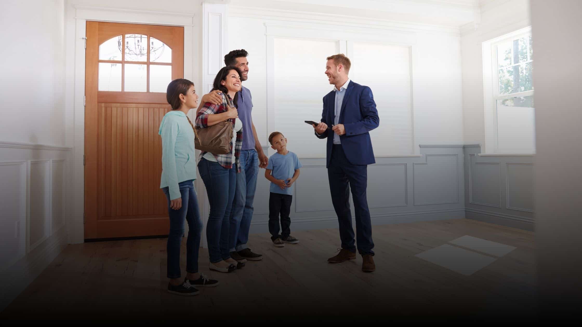 Realtor showing a home to a young family
